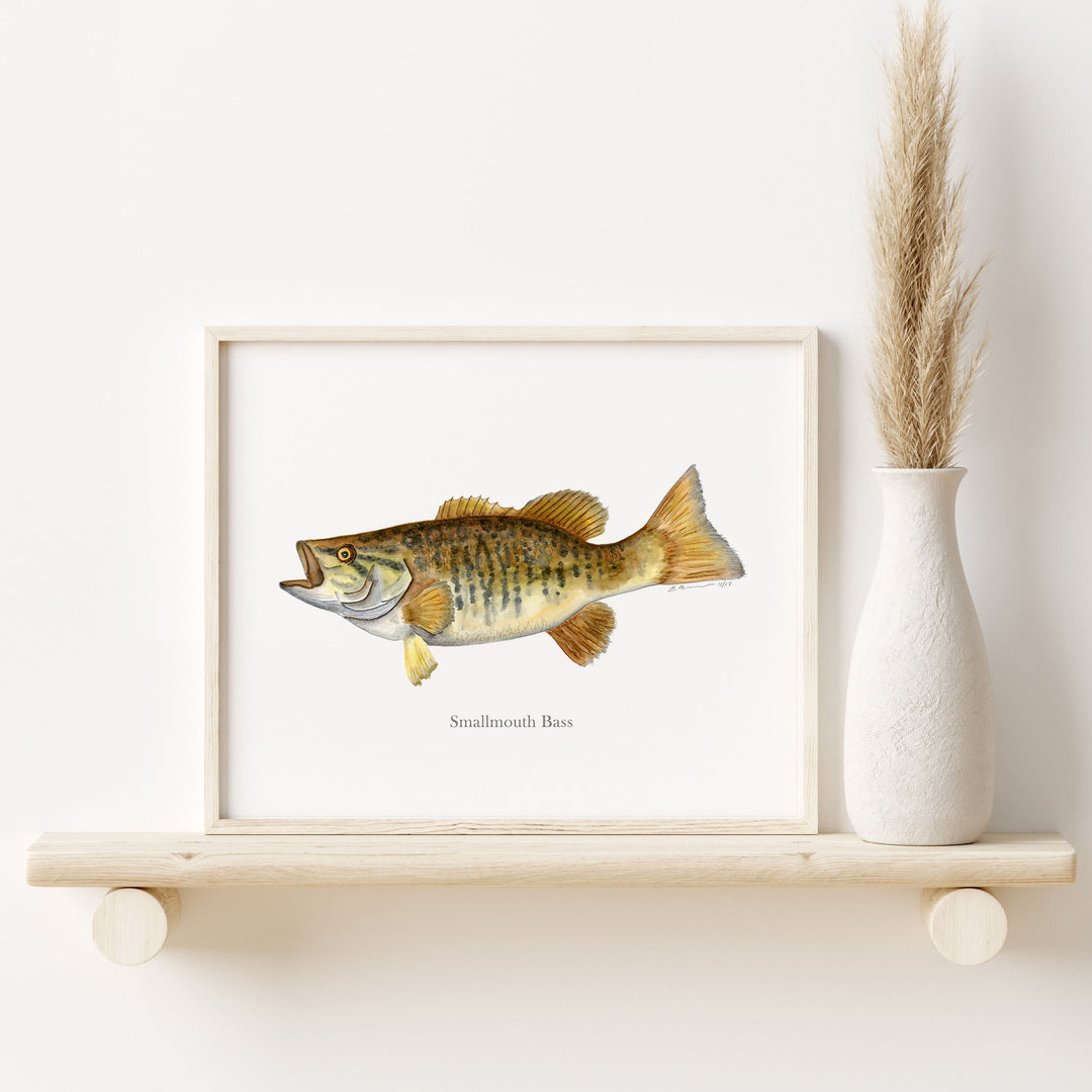 a picture of a smallmouth bass fish on a shelf next to a vase