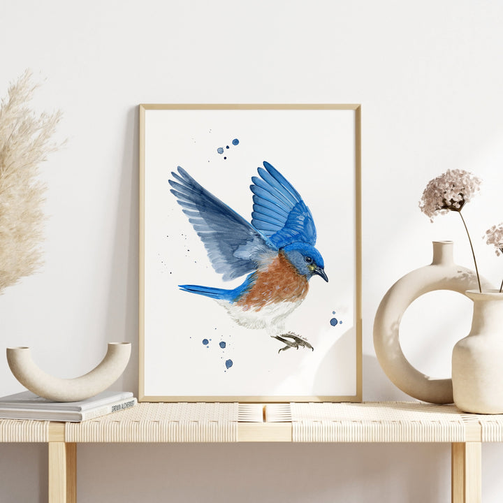 a painting of a blue bird on a white wall