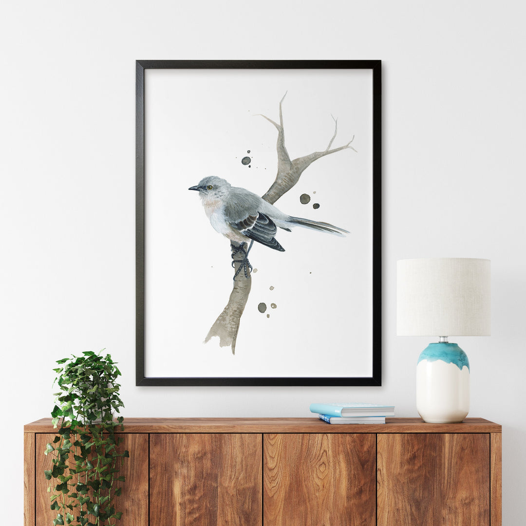 a bird is sitting on a branch in a frame