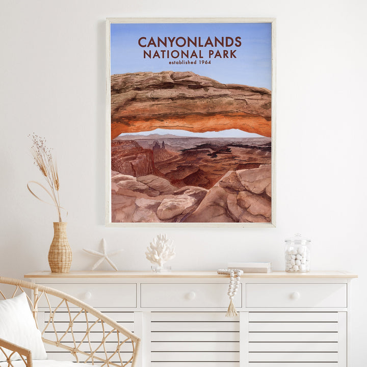 a poster of canyonlands national park hangs on a wall