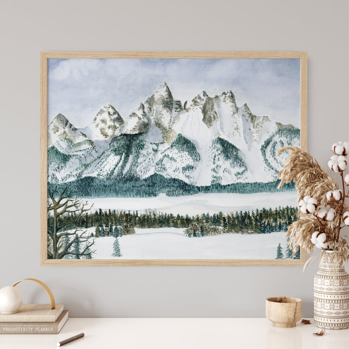 a painting of a snowy mountain range in a frame