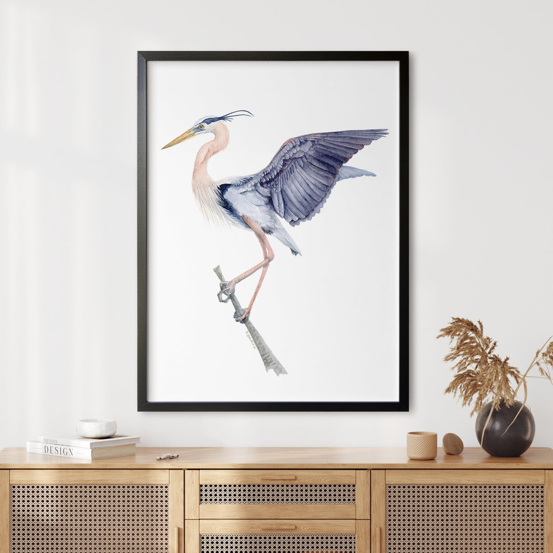 a framed picture of a bird on a branch