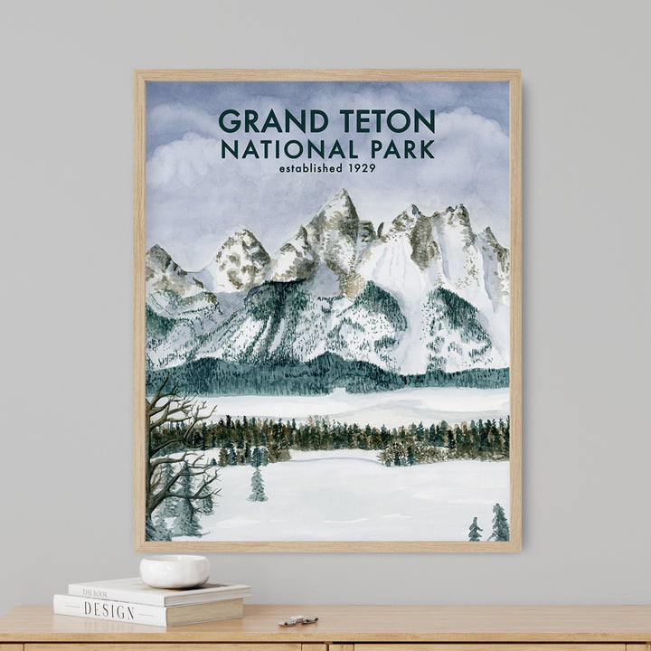 a picture of a snowy mountain range with the grand teton national park on it