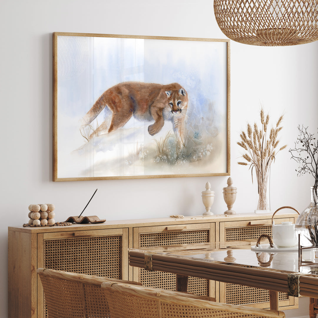 Edge Walker mountain lion watercolor painting displayed on a neutral dining room wall, in a wood frame