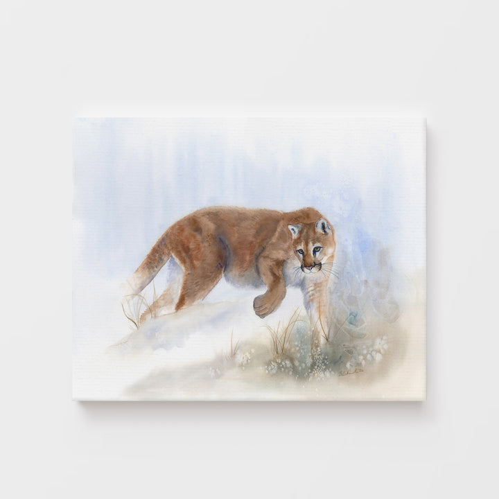 watercolor painting of a mountain lion moving low through a dissolving blue-grey landscape, rendered with precision against an atmospheric background