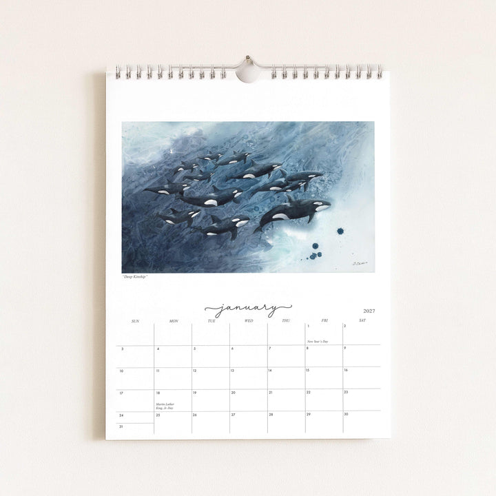 Watercolor painting of orcas titled "Deep Kinship," featured in the 2027 wildlife calendar