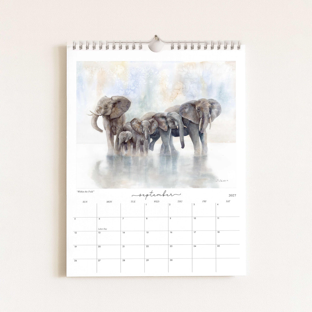 Watercolor painting of an elephant herd titled "Within the Fold," featured in the 2027 wildlife calendar