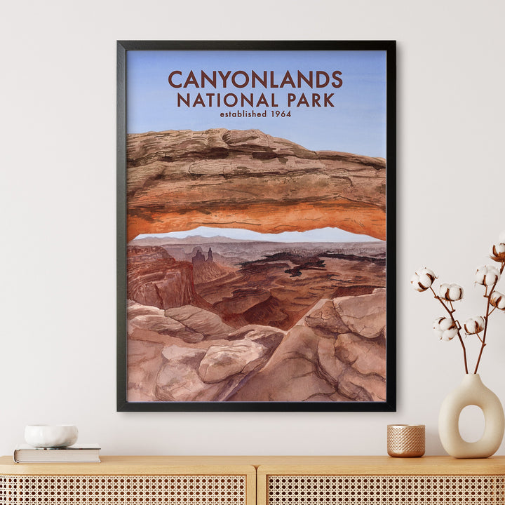 a poster of canyonlands national park hanging on a wall