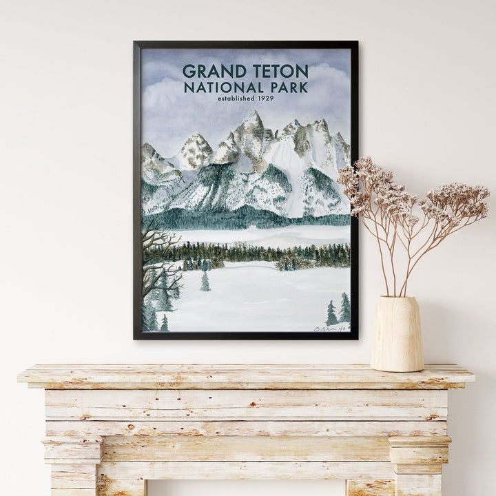 a picture of grand teton national park hanging on a wall